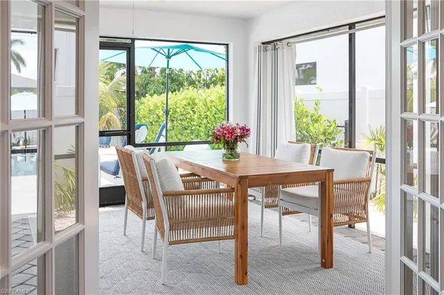 a dining room with furniture window wooden floor