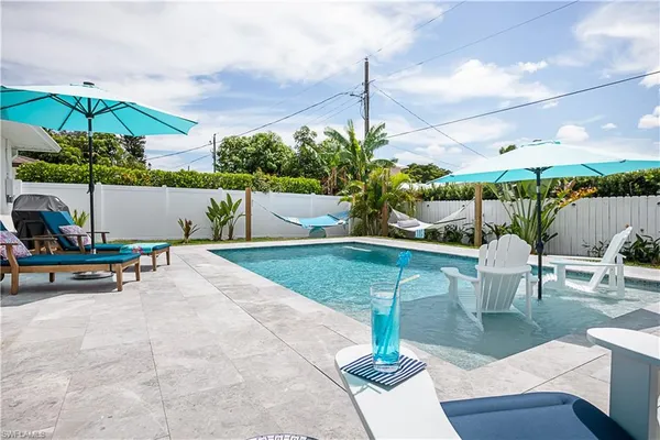 a view of a swimming pool with a patio
