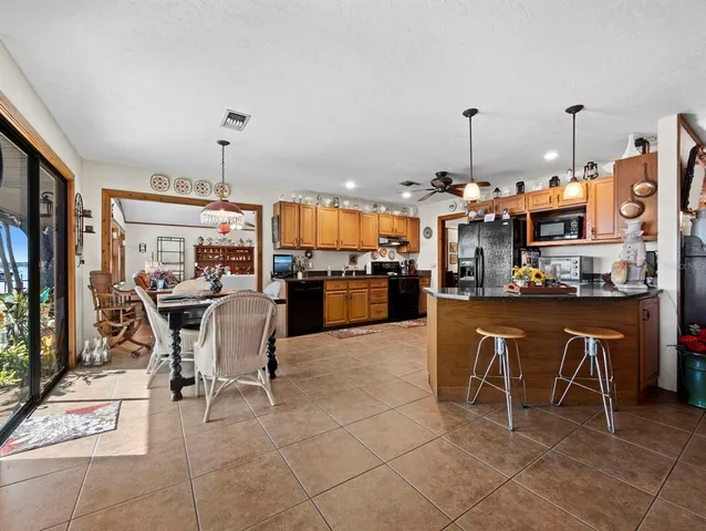 a view of a swimming pool with furniture