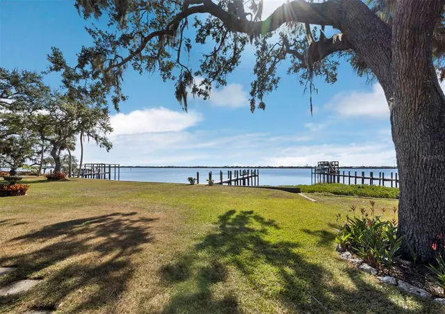 a view of a swimming pool and an outdoor seating