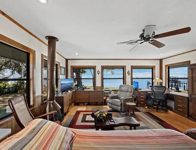 a room with furniture and a painting on the wall