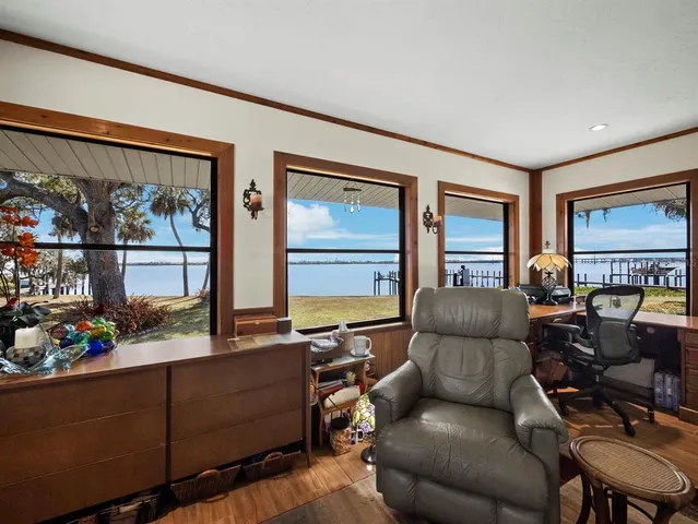 a view of a swimming pool with a table and chairs