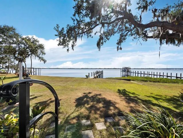 a bedroom with a large bed and a large window