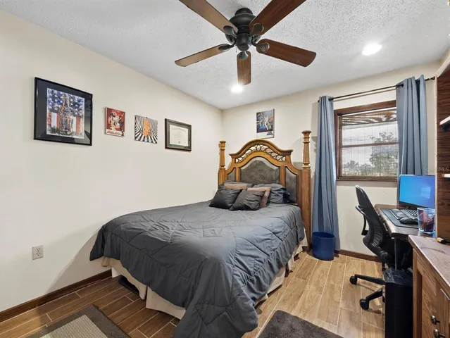 an aerial view of a houses with a lake view