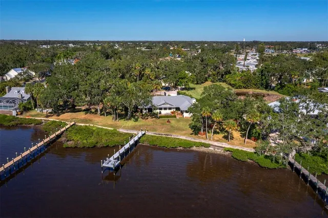 an aerial view of a house with a swimming pool