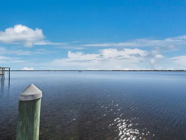 an aerial view of residential building with parking space
