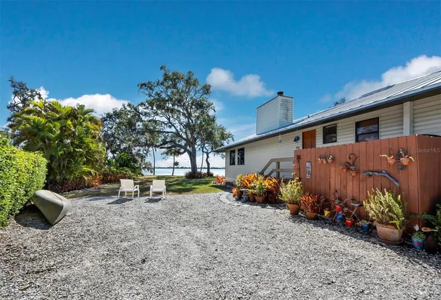 an aerial view of a house with a lake view