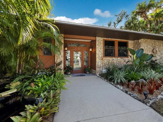 a view of a house with a small garden