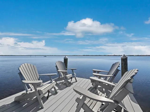 a view of a chairs and table on the deck