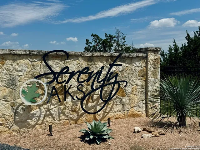 a picture of a yard with wooden fence