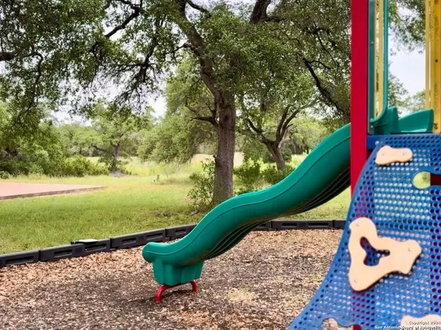 a view of a two chairs next to a yard