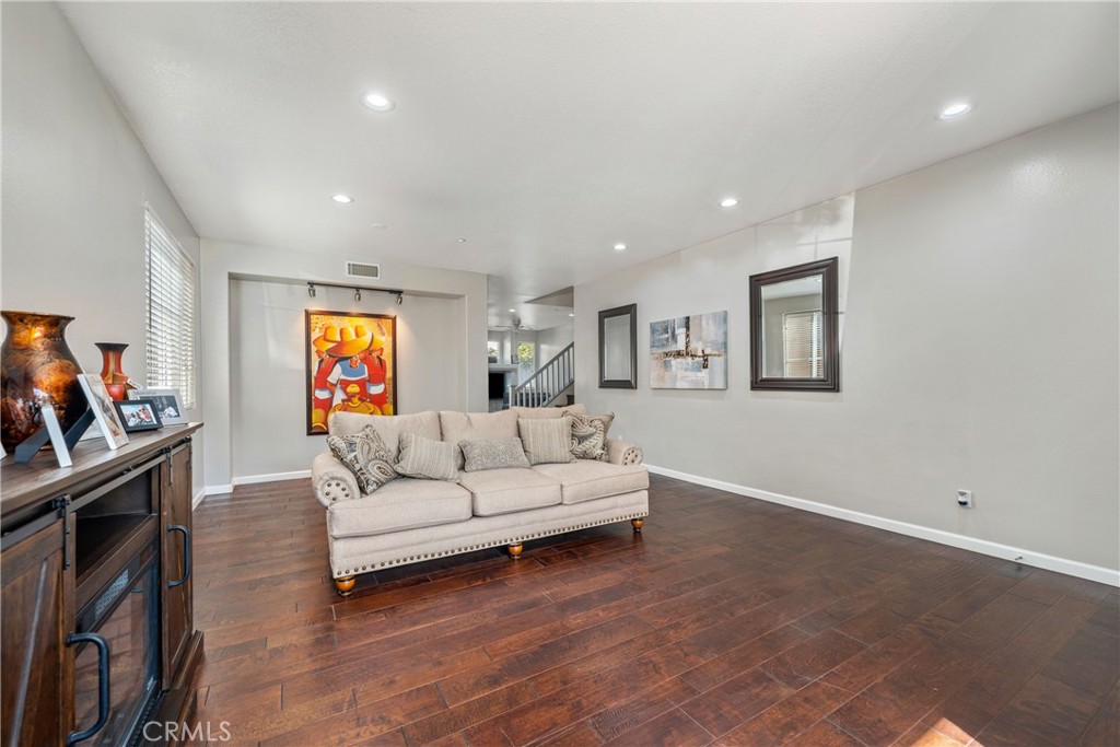 11141 Gardenhurst Court Riverside, CA 92505 - Photo 13 of 65 a living room with furniture and a flat screen tv
