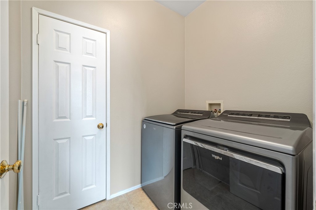 11141 Gardenhurst Court Riverside, CA 92505 - Photo 27 of 65 a utility room with washer and dryer