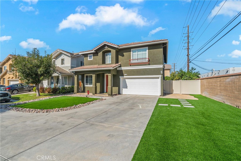 11141 Gardenhurst Court Riverside, CA 92505 - Photo 4 of 65 a front view of a house with a yard