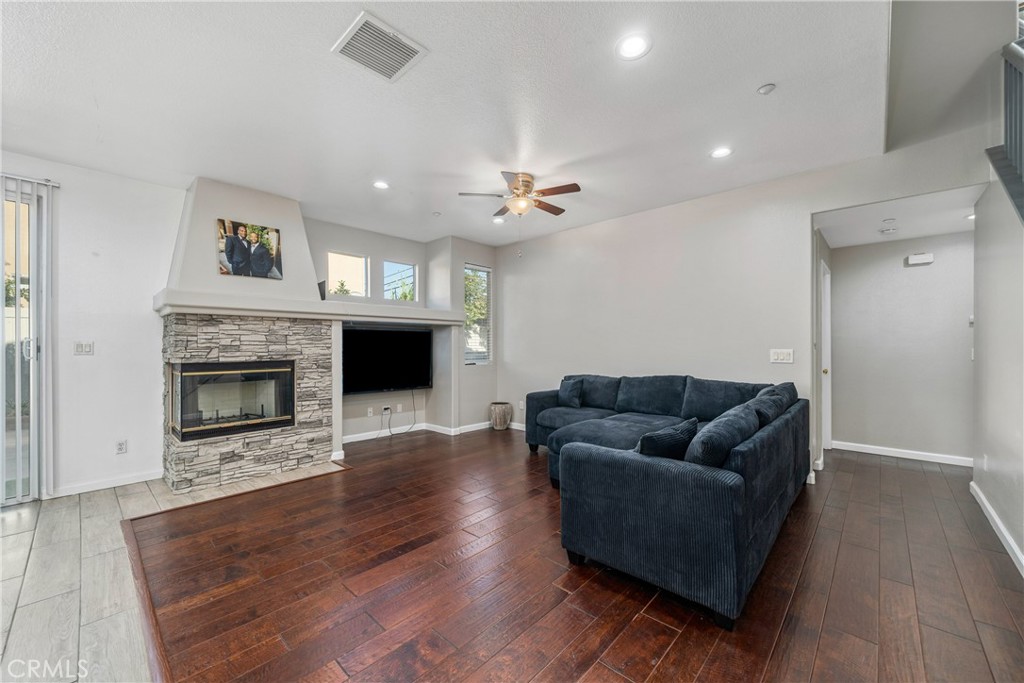 11141 Gardenhurst Court Riverside, CA 92505 - Photo 9 of 65 a living room with furniture and a fireplace