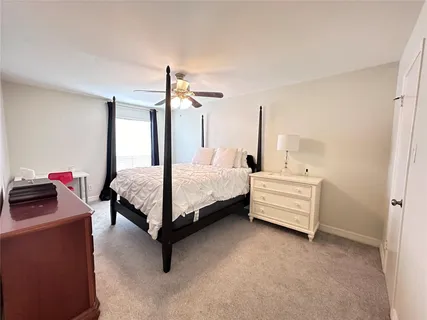a bedroom with a bed and a table