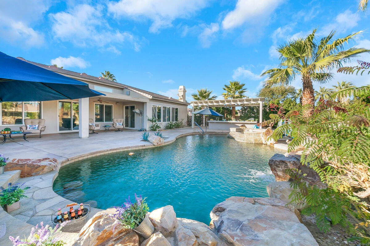 49130 Escalante Street Indio, CA 92201 - Photo 1 of 99 a view of a swimming pool with a patio