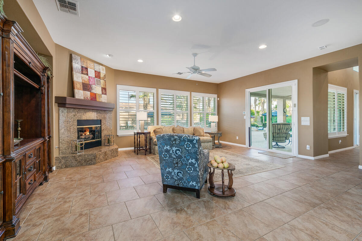 49130 Escalante Street Indio, CA 92201 - Photo 23 of 99 a living room with furniture large window and flat screen tv