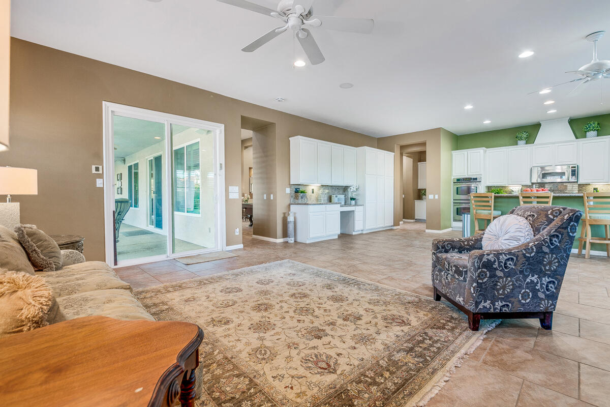 49130 Escalante Street Indio, CA 92201 - Photo 24 of 99 a living room with furniture and a kitchen area