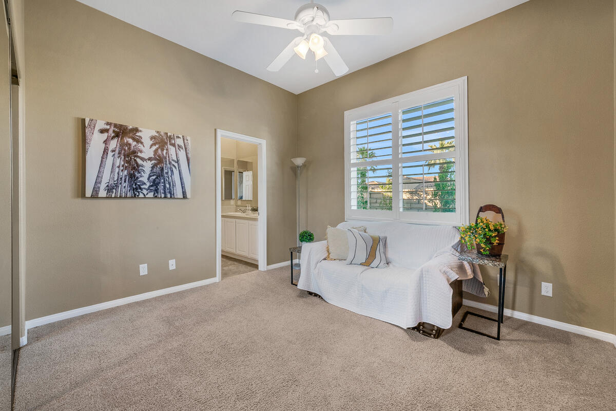 49130 Escalante Street Indio, CA 92201 - Photo 34 of 99 a living room with furniture and a large window