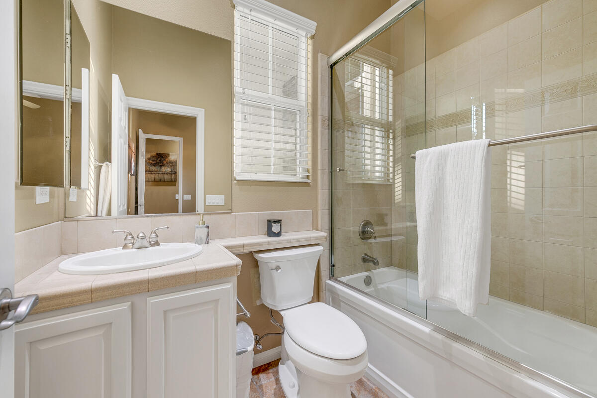 49130 Escalante Street Indio, CA 92201 - Photo 37 of 99 a bathroom with a sink toilet and shower