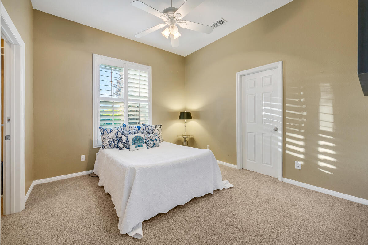 49130 Escalante Street Indio, CA 92201 - Photo 38 of 99 a bedroom with a bed and a window