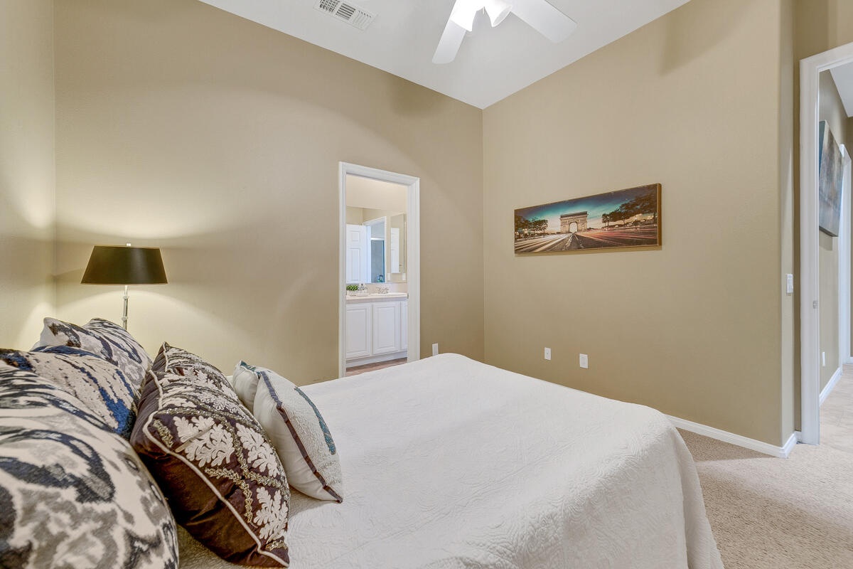 49130 Escalante Street Indio, CA 92201 - Photo 39 of 99 a bedroom with a bed and a window