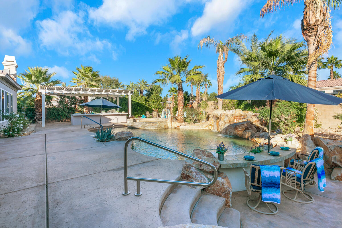 49130 Escalante Street Indio, CA 92201 - Photo 46 of 99 a view of a backyard with sitting area and furniture