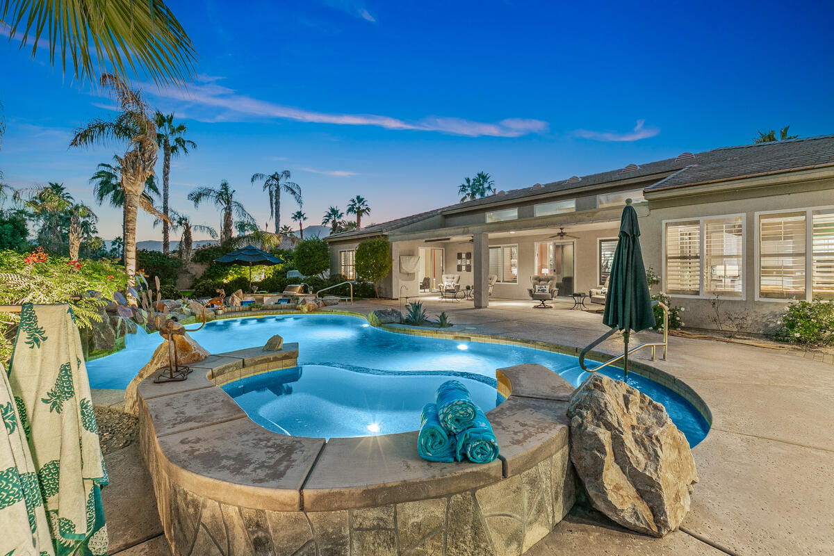 49130 Escalante Street Indio, CA 92201 - Photo 67 of 99 a view of a house with swimming pool and sitting area