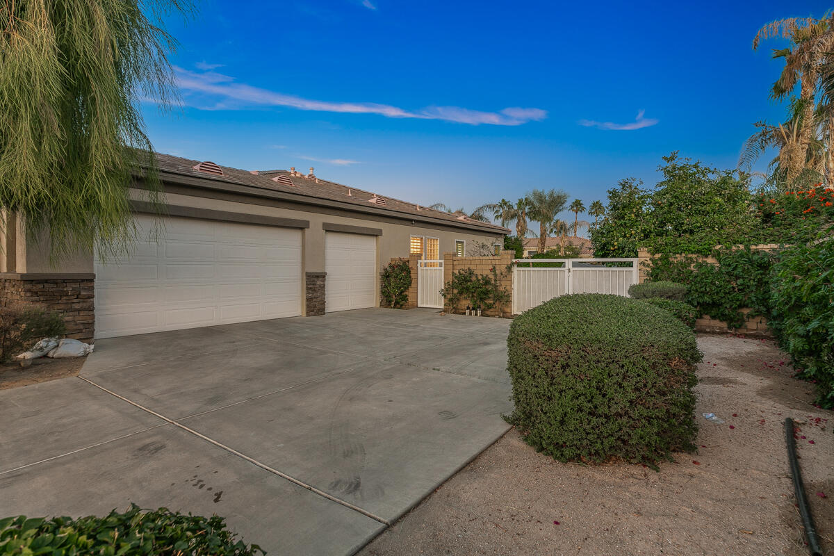 49130 Escalante Street Indio, CA 92201 - Photo 74 of 99 a front view of a house with a yard