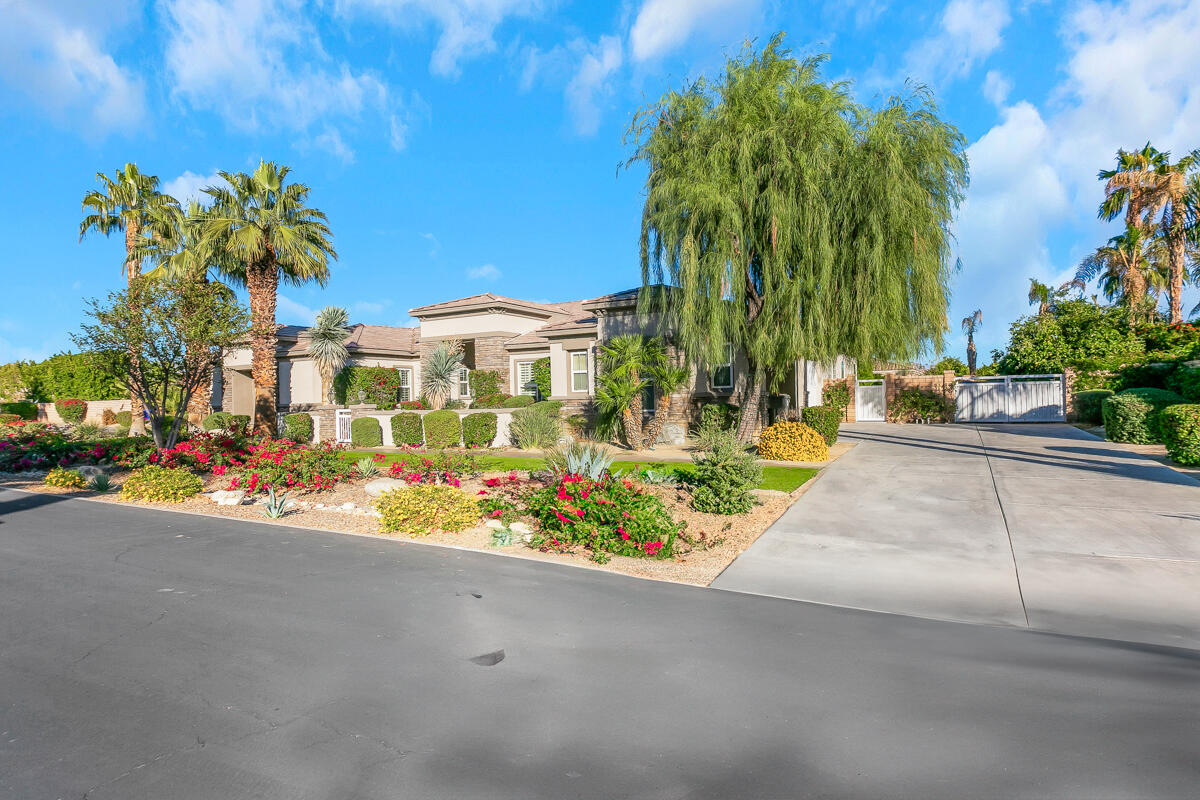 49130 Escalante Street Indio, CA 92201 - Photo 77 of 99 a view of a street with a cars parked in front of it