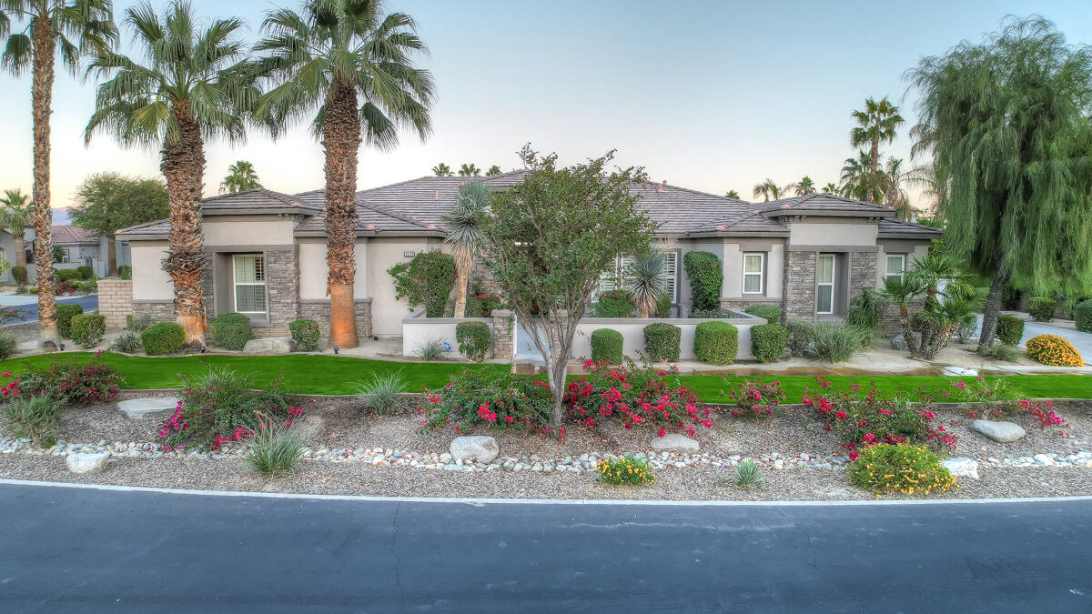 49130 Escalante Street Indio, CA 92201 - Photo 78 of 99 a front view of a house with a garden and a yard