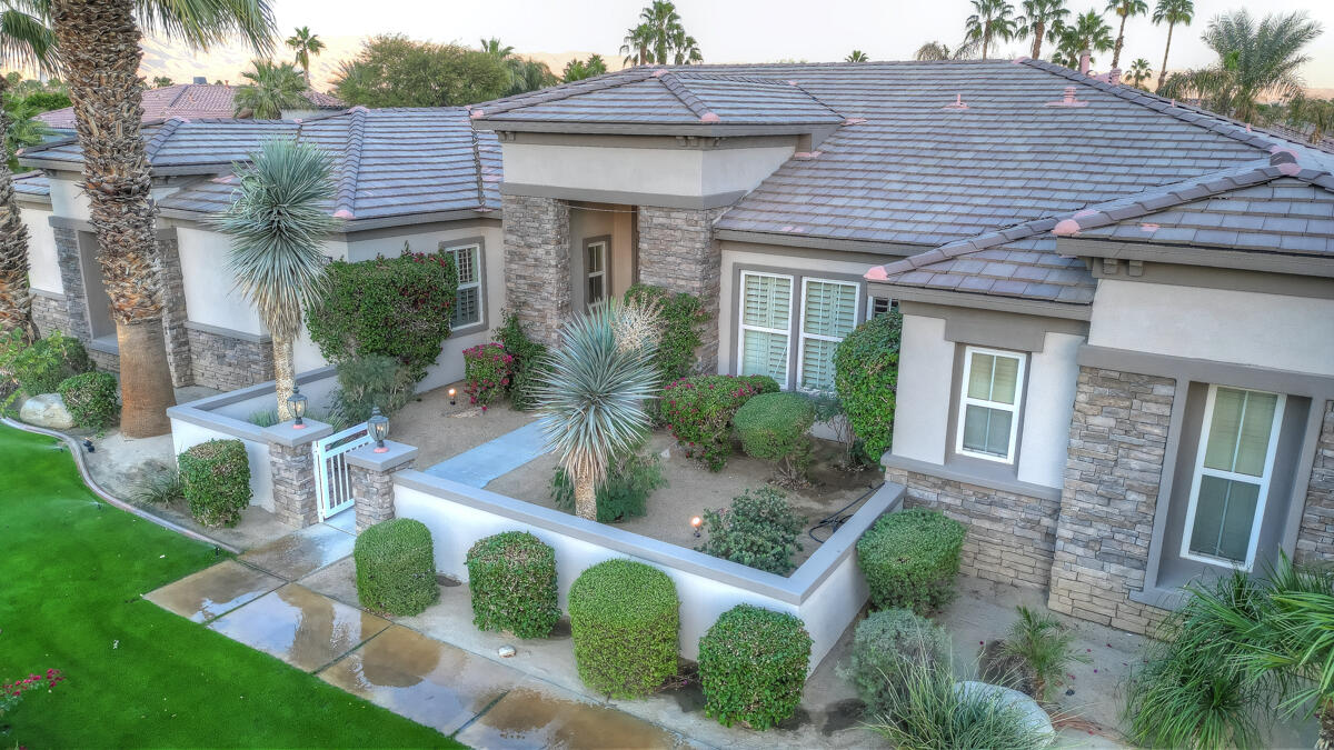 49130 Escalante Street Indio, CA 92201 - Photo 80 of 99 a front view of house with yard and green space