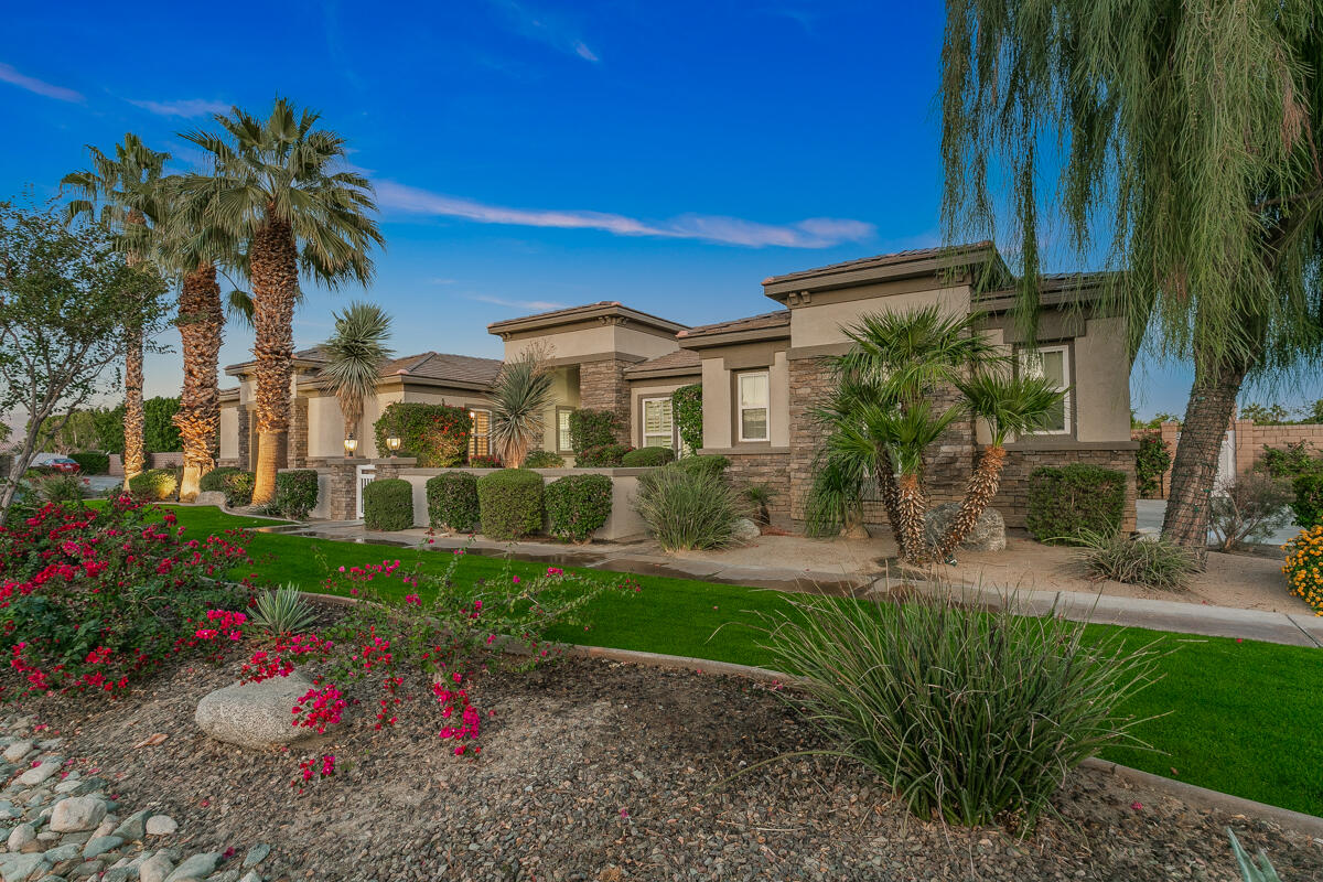 49130 Escalante Street Indio, CA 92201 - Photo 82 of 99 a view of a house with a yard and potted plants