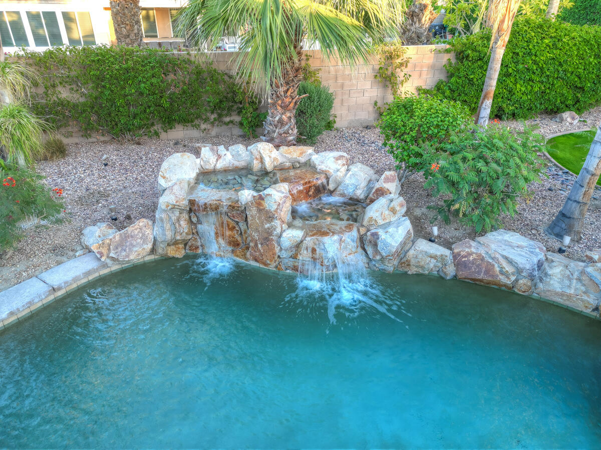 49130 Escalante Street Indio, CA 92201 - Photo 92 of 99 a backyard of a house with lots of green space