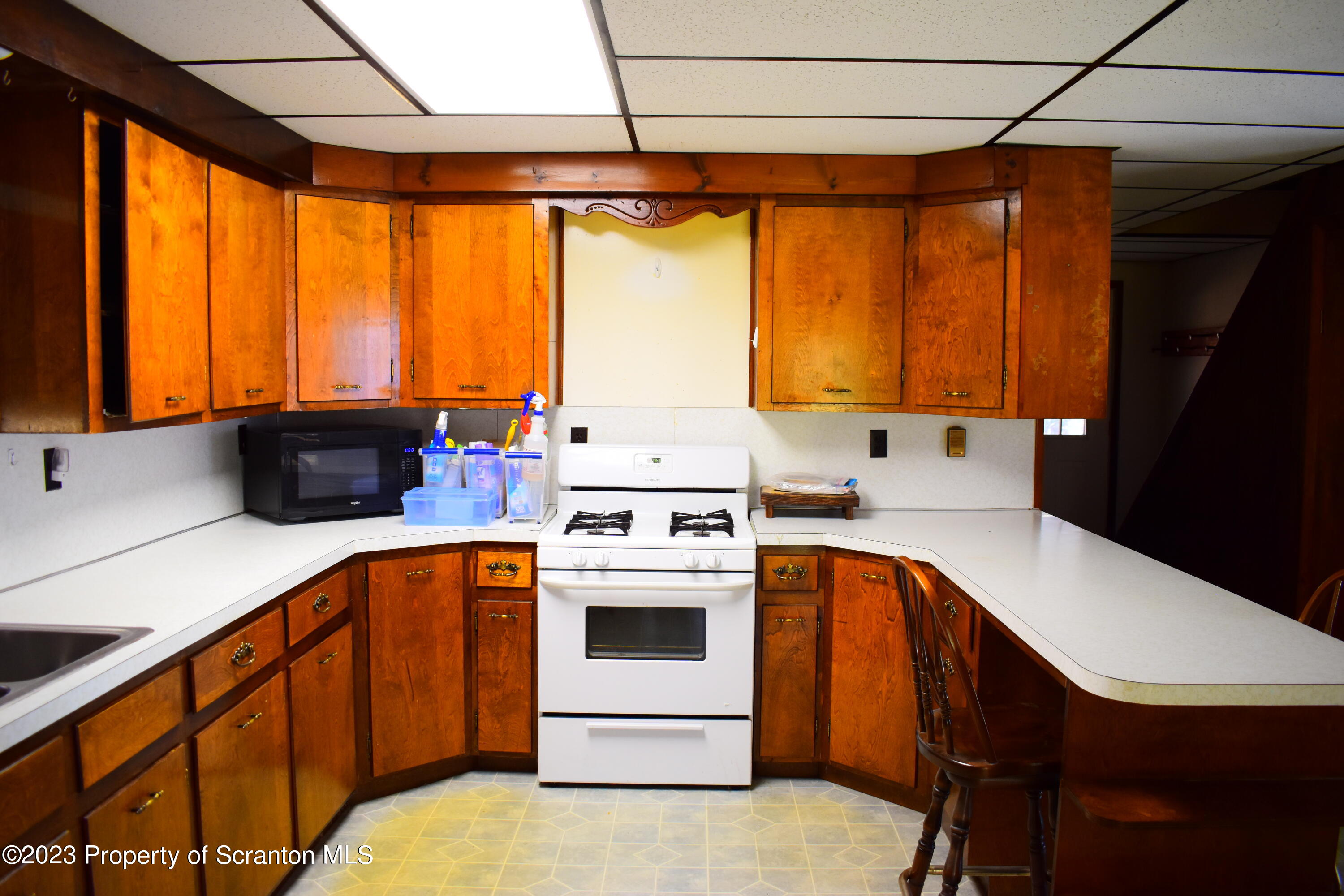 2791 Liberty Park Road Hallstead, PA 18822 - Photo 11 of 41 a kitchen with stainless steel appliances a stove a sink and white cabinets