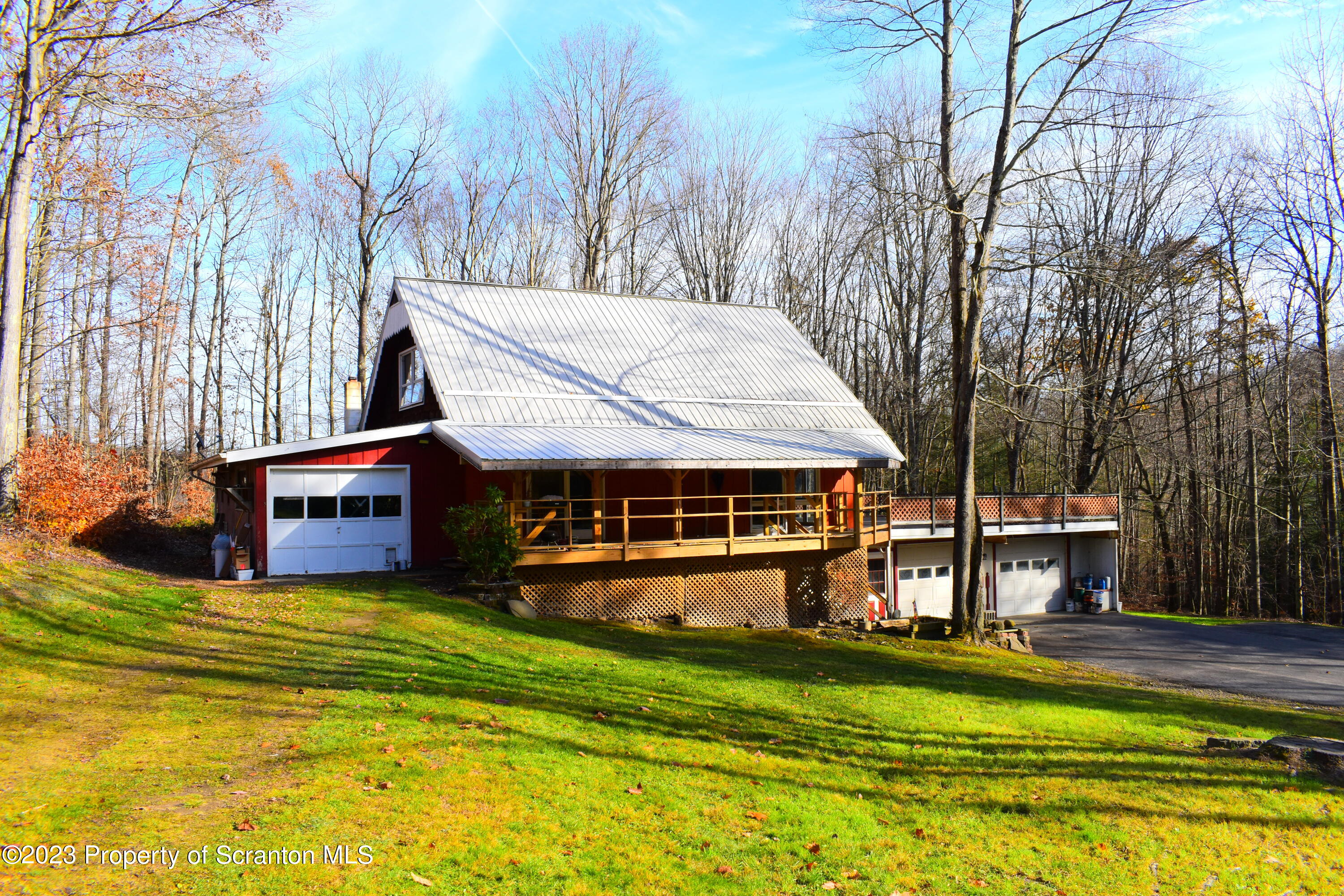 2791 Liberty Park Road Hallstead, PA 18822 - Photo 2 of 41 a view of a house with a big yard and sitting area