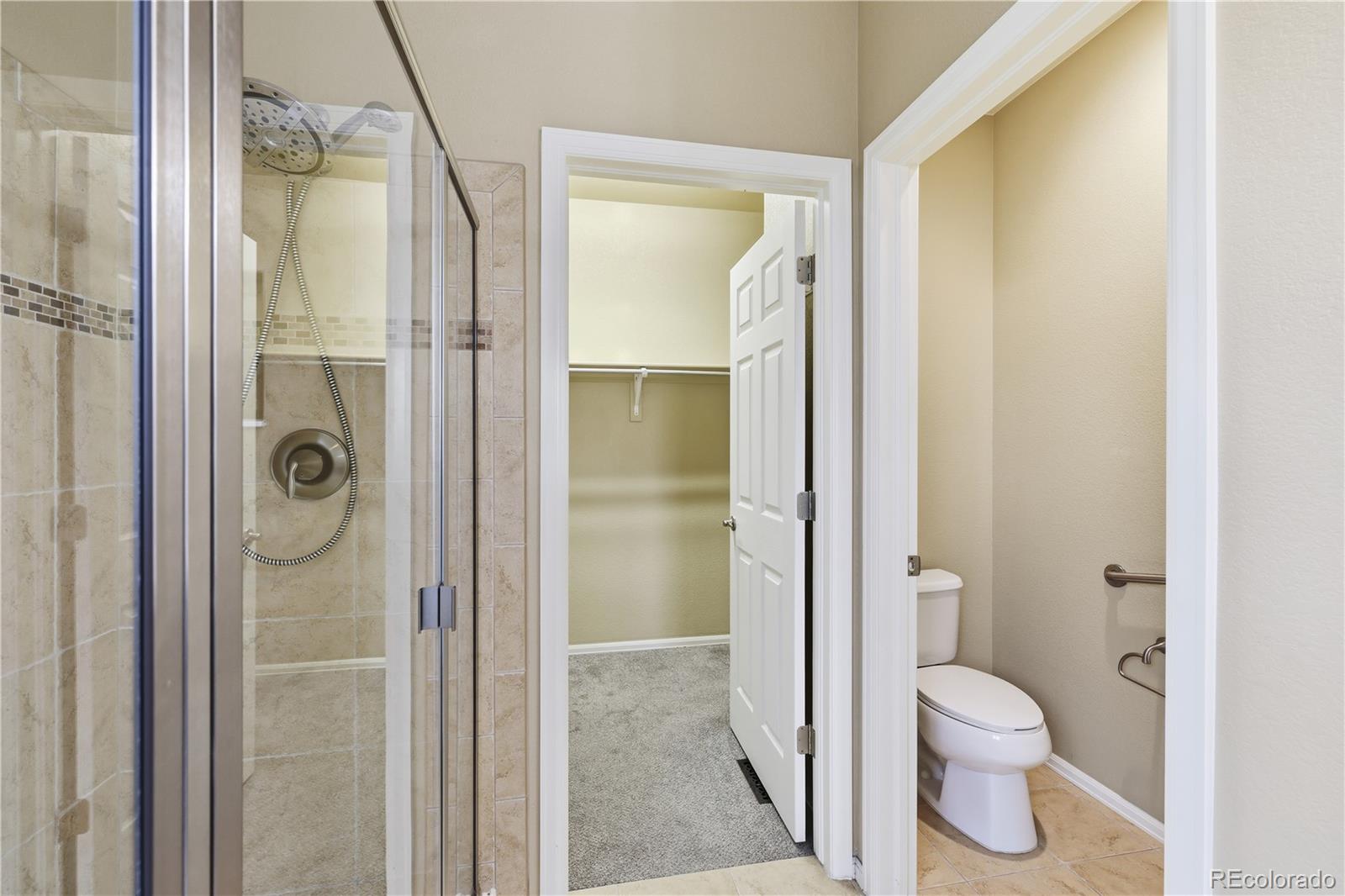 3932 Desert Ridge Circle Castle Rock, CO 80108 - Photo 16 of 49 a bathroom with a granite countertop toilet