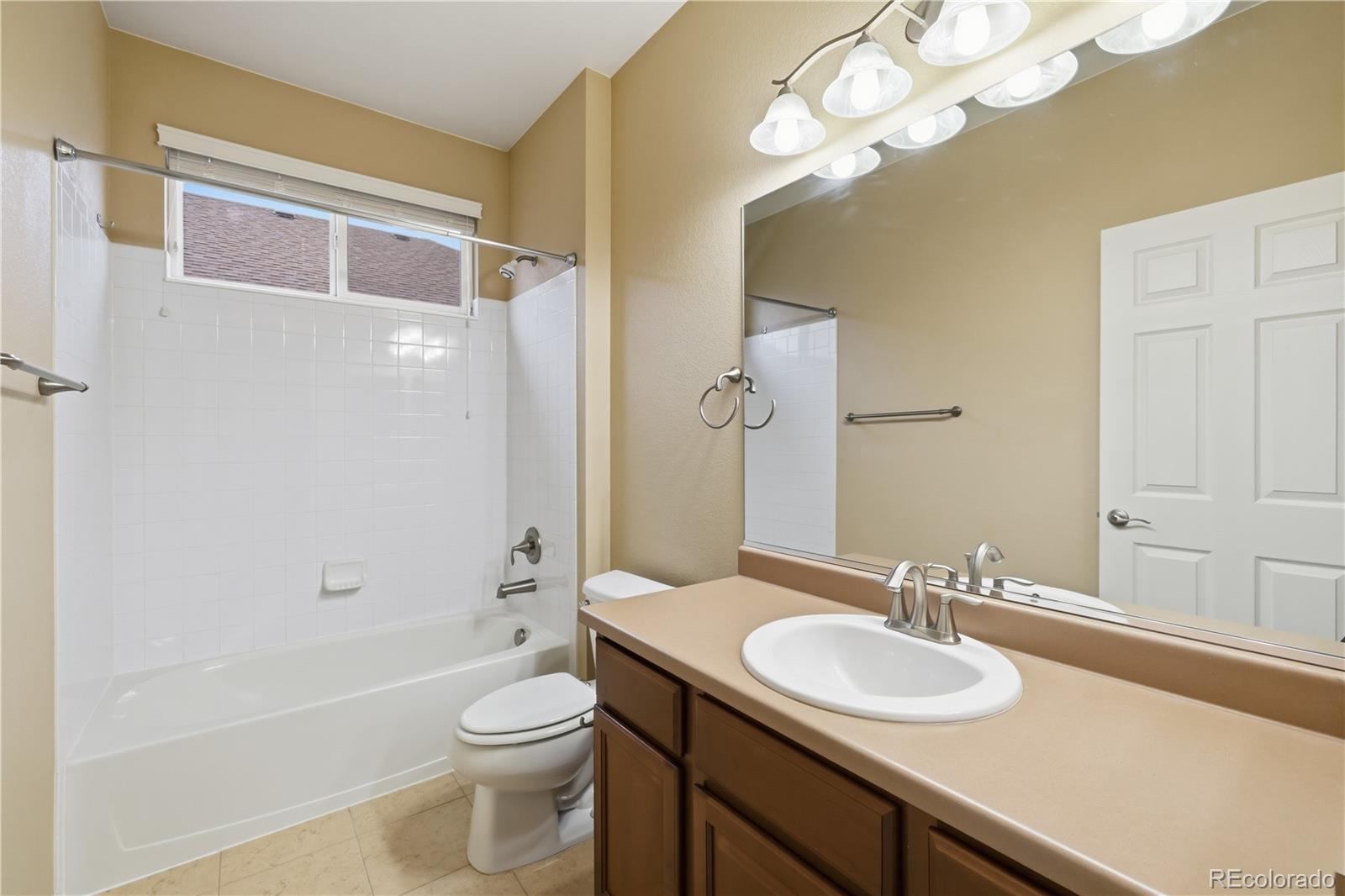 3932 Desert Ridge Circle Castle Rock, CO 80108 - Photo 22 of 49 a bathroom with a sink a toilet and shower