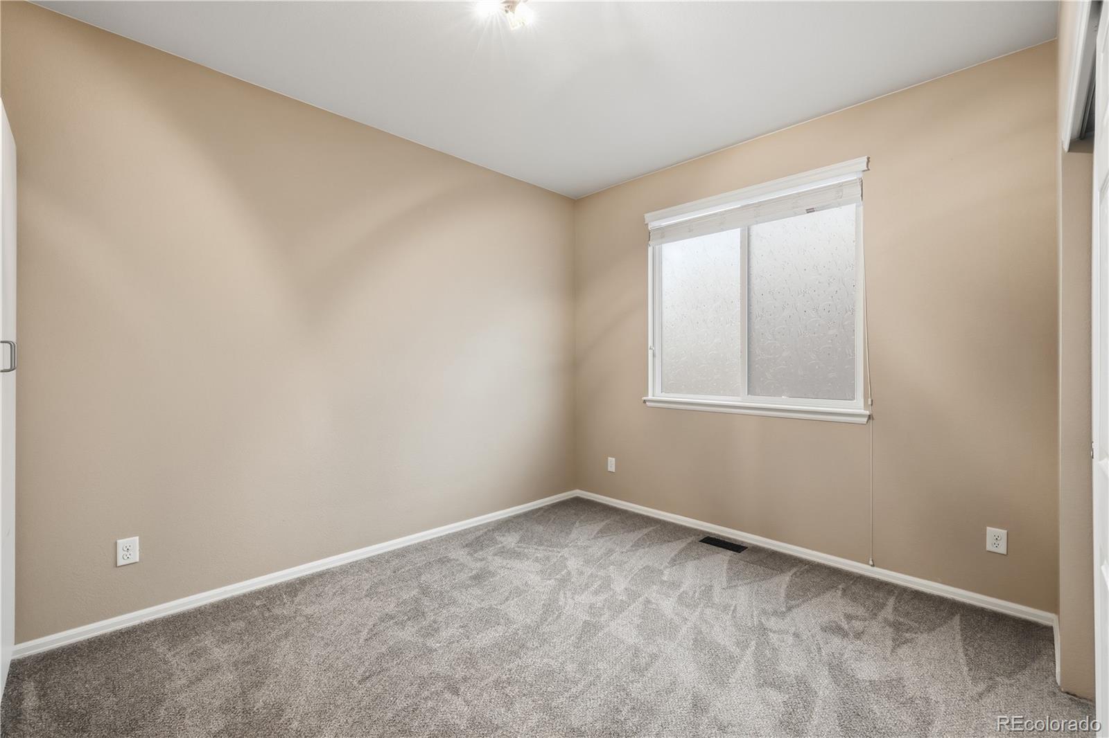 3932 Desert Ridge Circle Castle Rock, CO 80108 - Photo 23 of 49 an empty room with a window