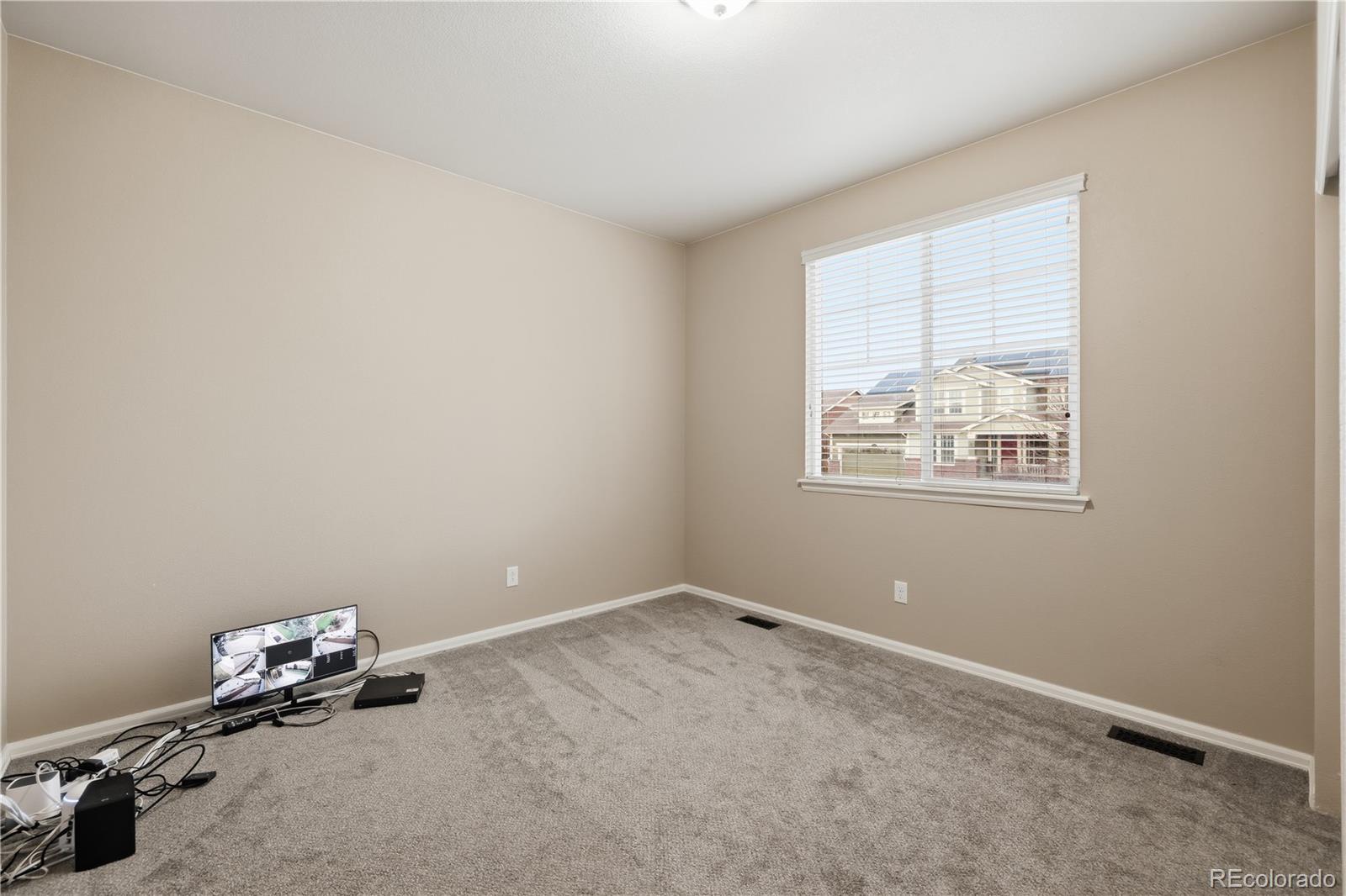 3932 Desert Ridge Circle Castle Rock, CO 80108 - Photo 24 of 49 an empty room with windows