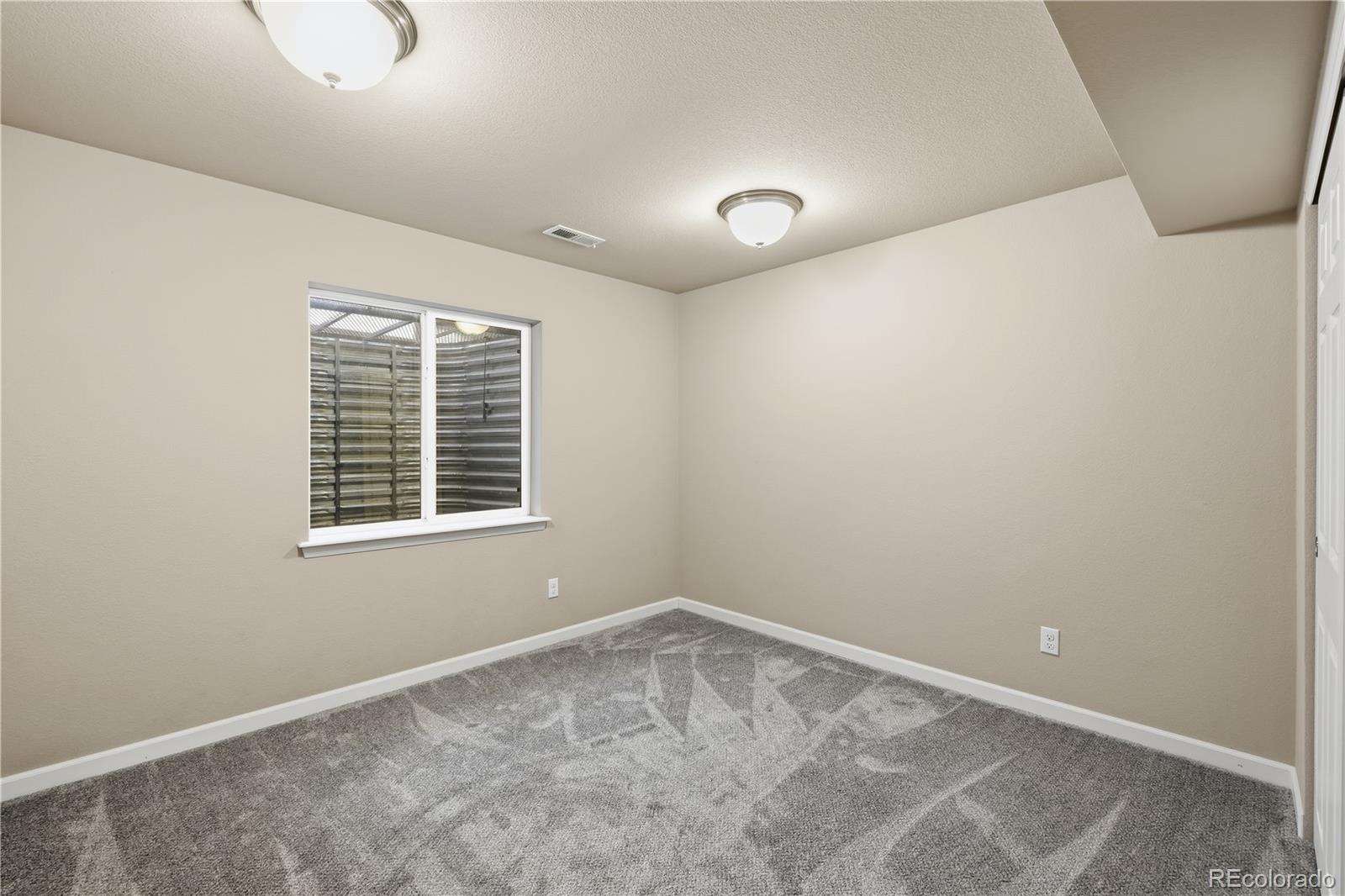 3932 Desert Ridge Circle Castle Rock, CO 80108 - Photo 27 of 49 an empty room with a window