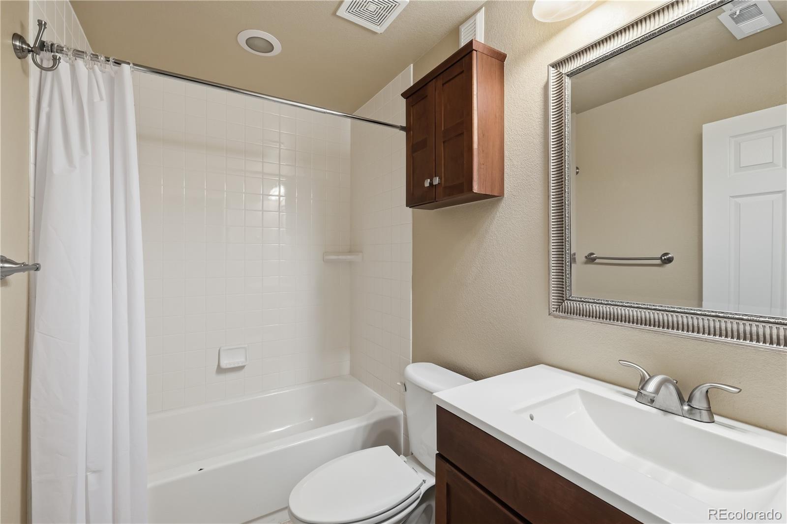 3932 Desert Ridge Circle Castle Rock, CO 80108 - Photo 28 of 49 a bathroom with a sink toilet and shower