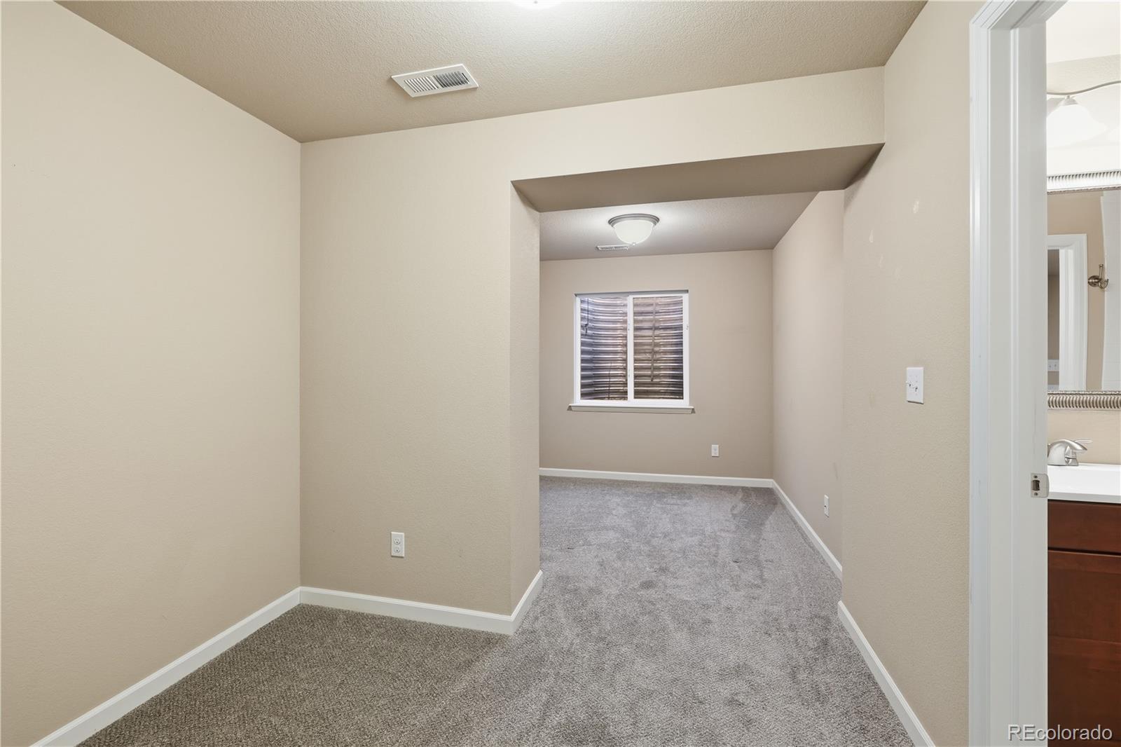 3932 Desert Ridge Circle Castle Rock, CO 80108 - Photo 29 of 49 an empty room with windows