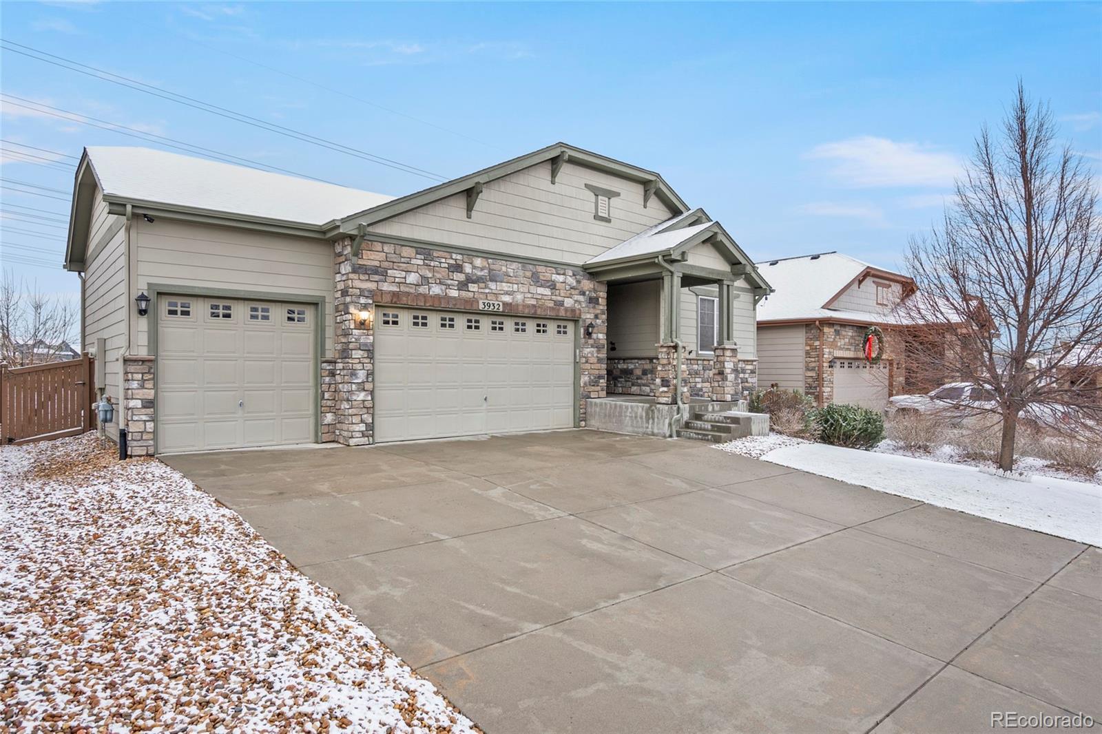 3932 Desert Ridge Circle Castle Rock, CO 80108 - Photo 3 of 49 a front view of a house with a yard and garage