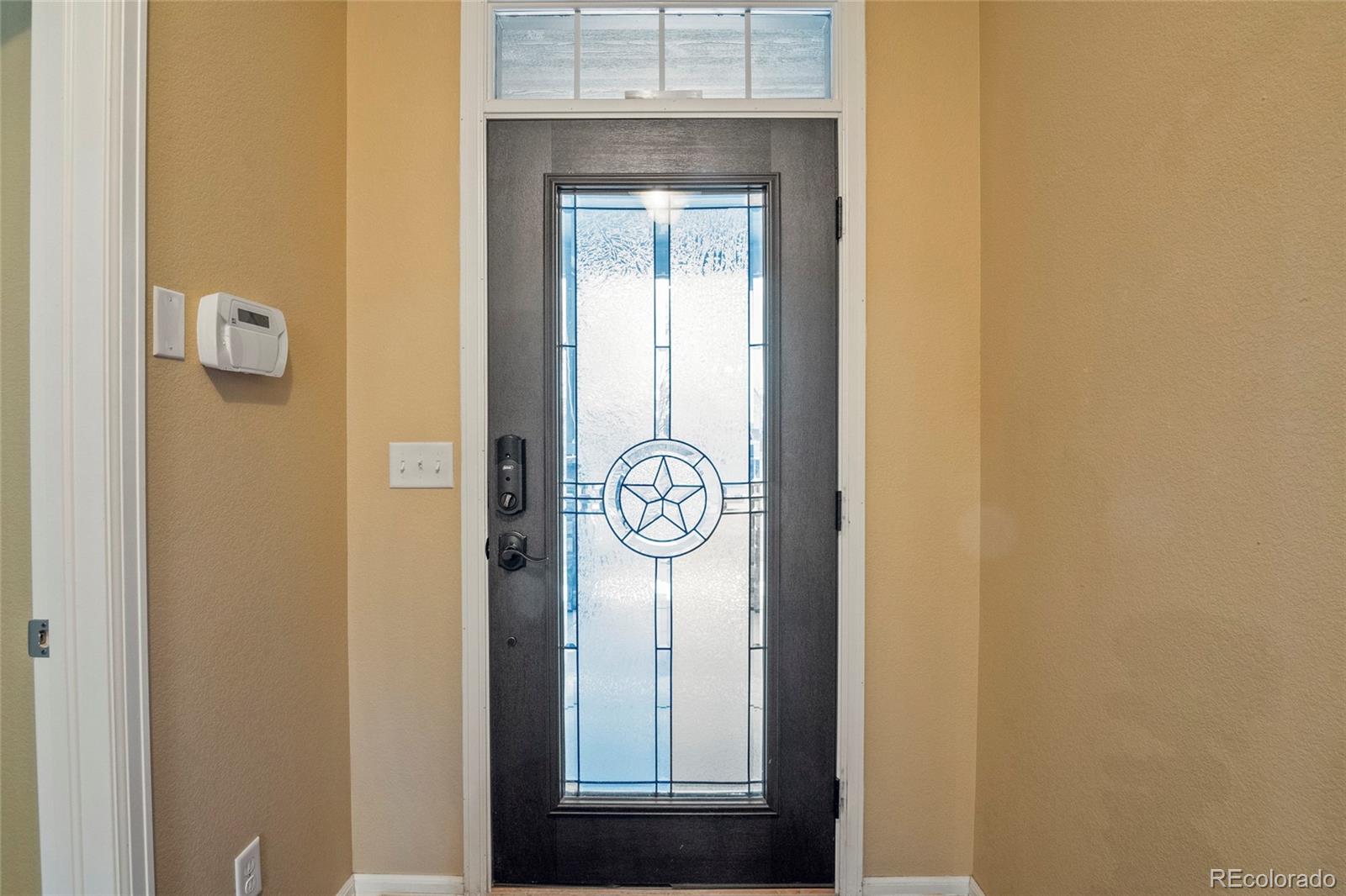 3932 Desert Ridge Circle Castle Rock, CO 80108 - Photo 46 of 49 a view of a hallway with elevator