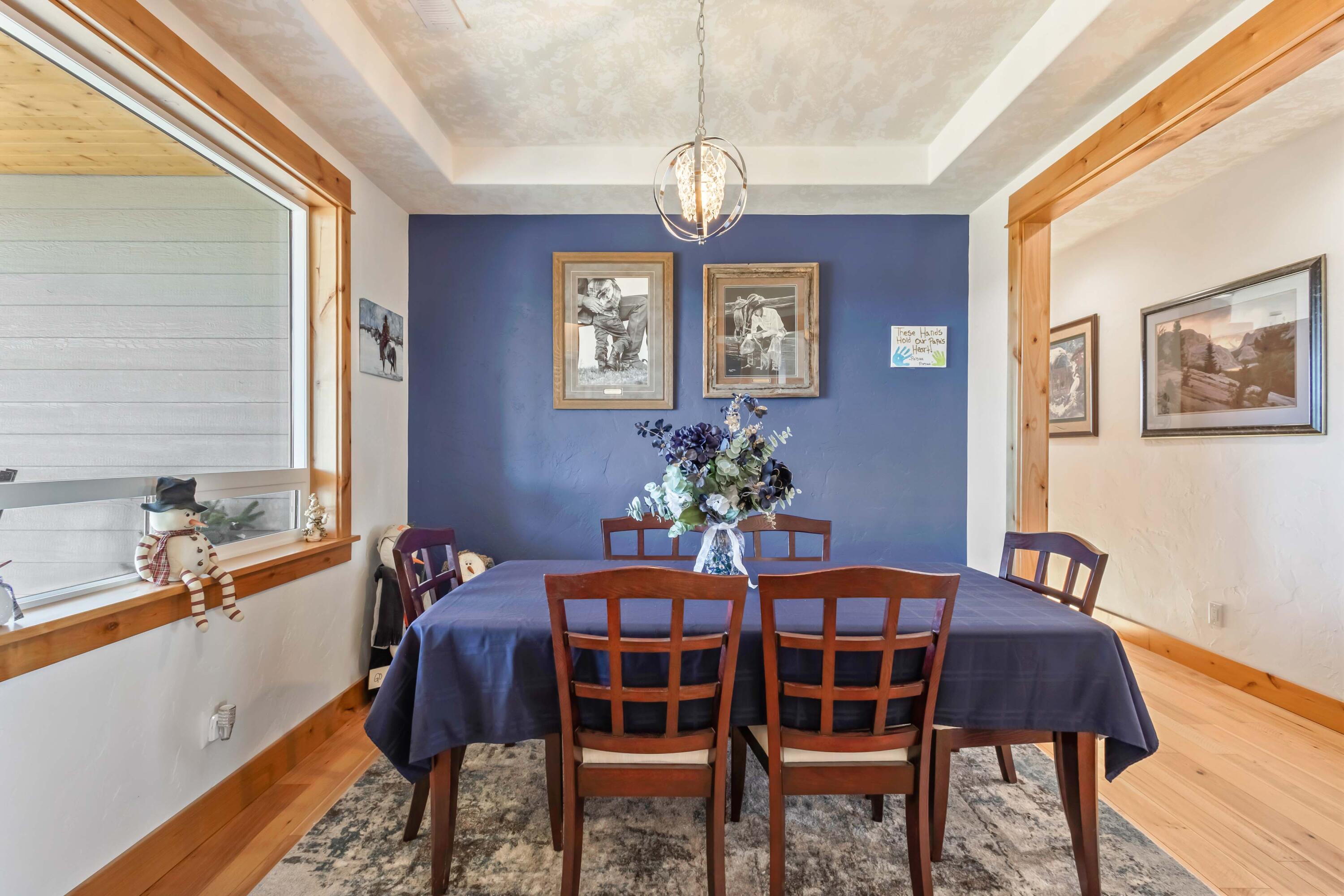 5582 North Mckay Road Prineville, OR 97754 - Photo 15 of 54 a view of a dining room with furniture window and wooden floor