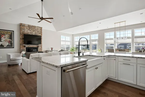a kitchen with a stove a sink and a refrigerator