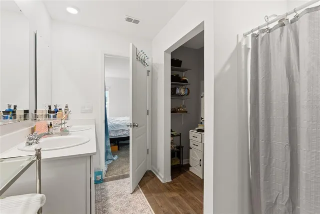 a en suite bathroom with a sink and a mirror