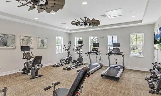 a kitchen with granite countertop a sink a counter top space appliances and cabinets